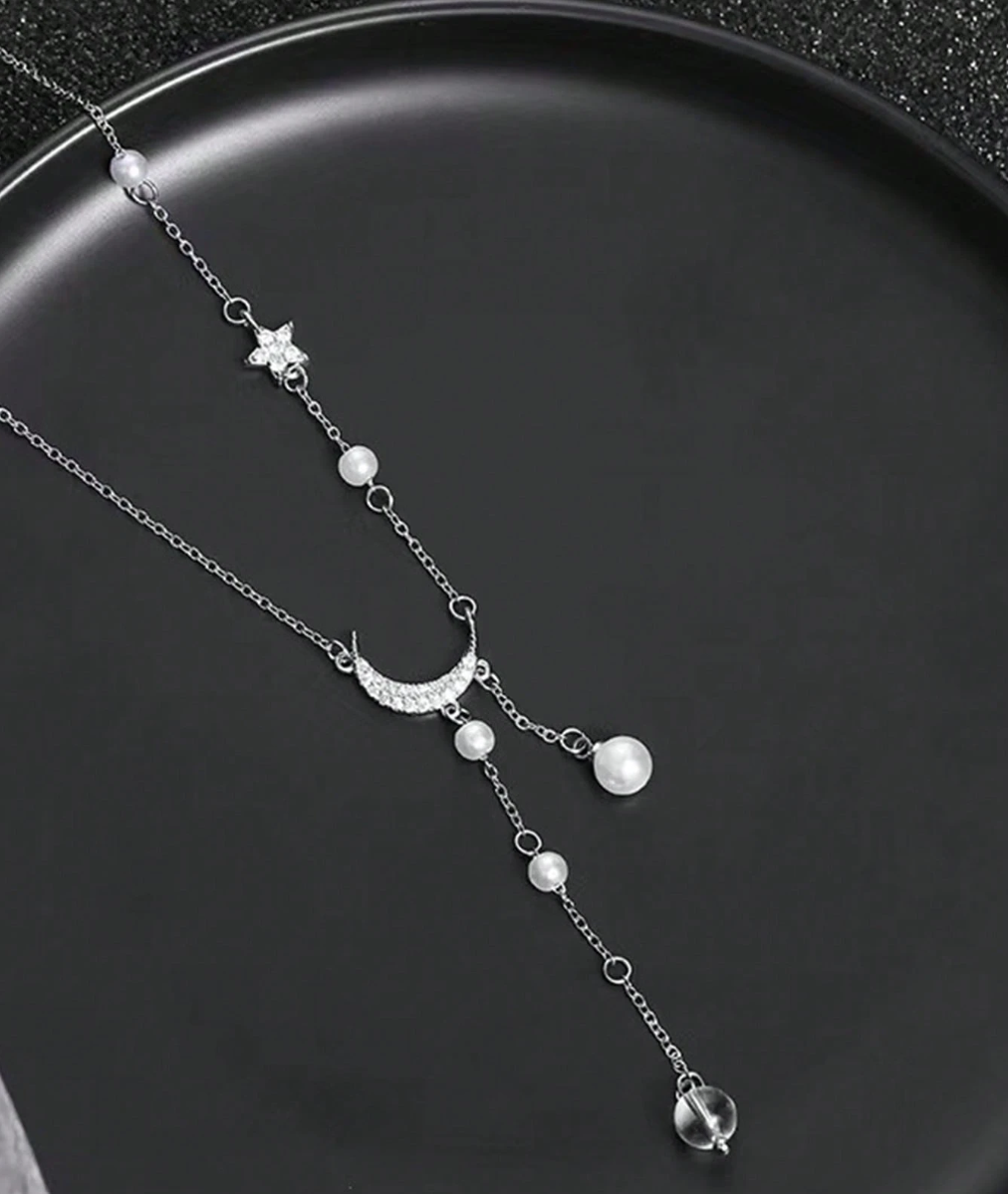 Collier Étoile et Lune Argenté – Bijou Raffiné avec Pompon Brillant pour Femme