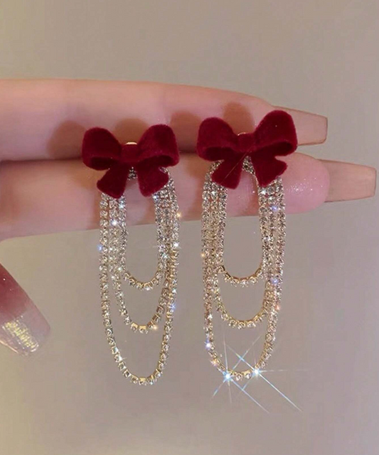 Paire de boucles d’oreilles à pompon papillon polyvalent à la mode